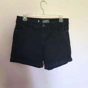 Women's black jean shorts, size 9.